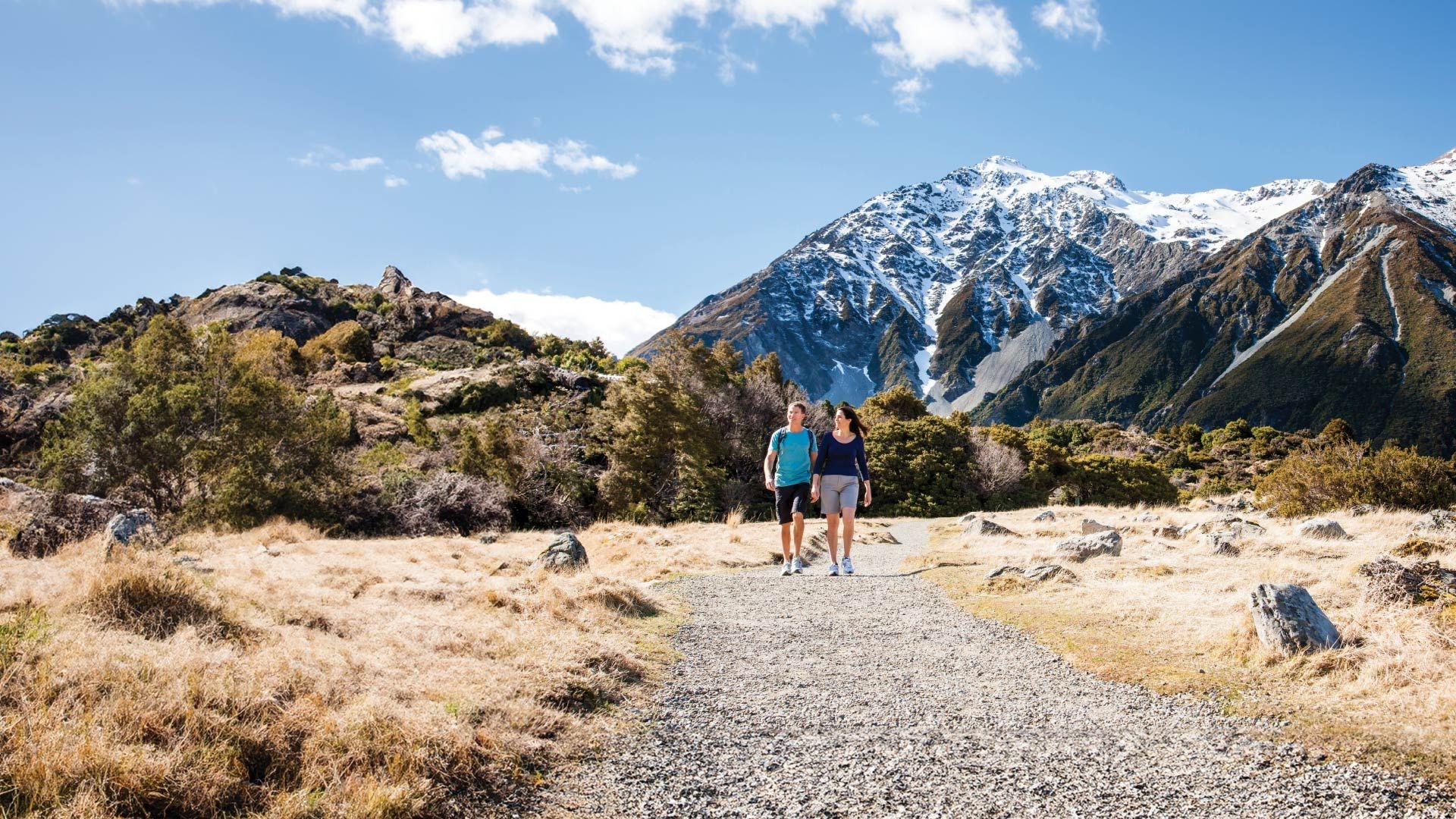 Couple walking a trail in New Zealand