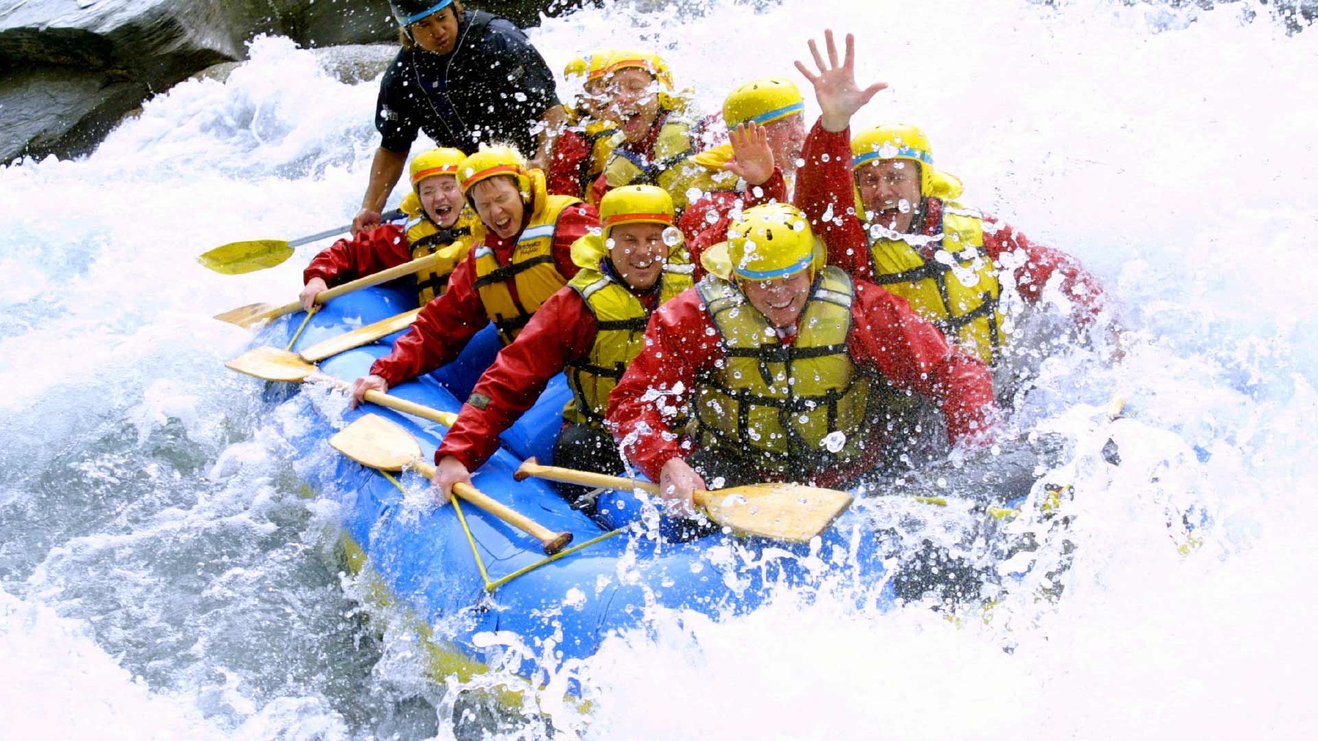 Boat full of people in rapids in Queenstown