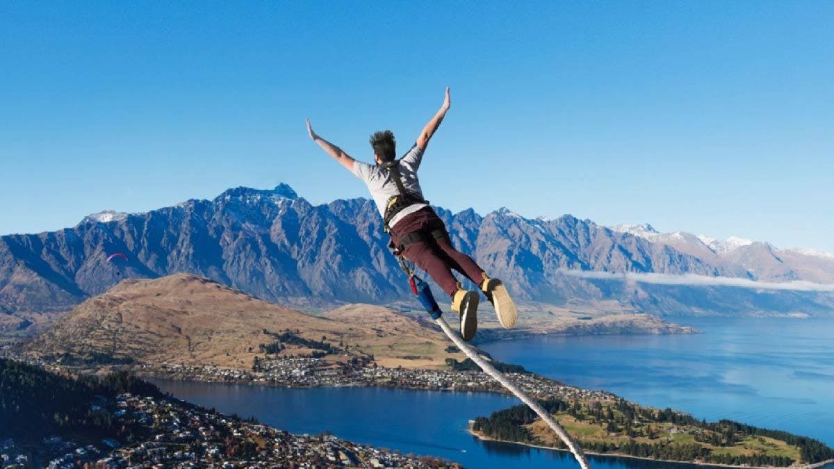 Man bungy jumping over Queenstown in New Zealand