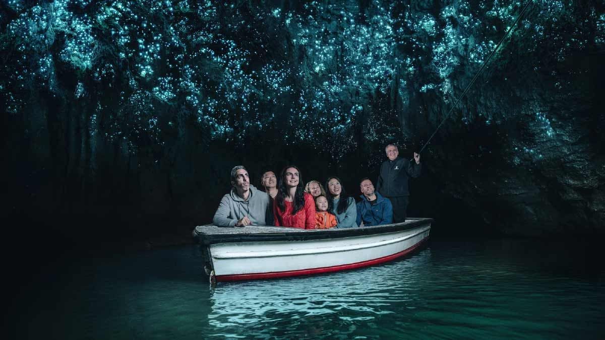 Group of people on a boat in the Waitomo caves