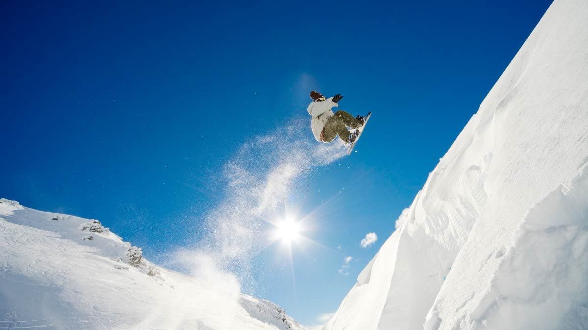Snowboarder doing a jump at The Remarkables