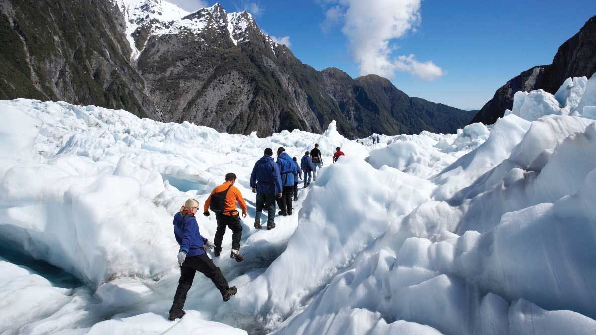 Group of people hiking on Franz Josef Glacier